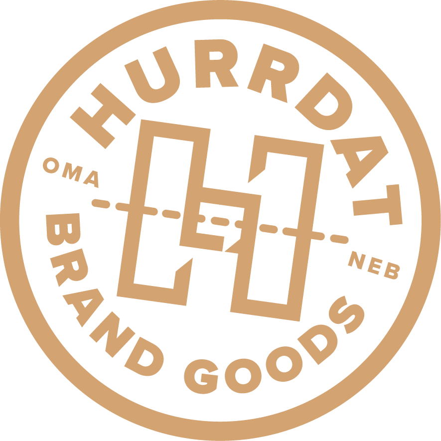 Hurrdat-BrandGoods-Badge-Tan Hurrdat Brand Goods Tan Badge Logo
